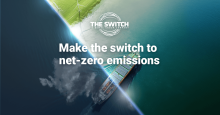 A cargo ship, the sea, wind turbines. Over the image, the logo: The Switch A Bemac Group Company. Additionally, the text: Make the switch to net-zero emissions.